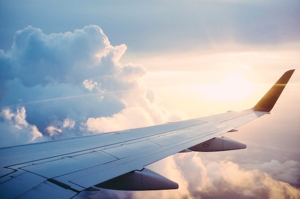 Airplane flying above the clouds